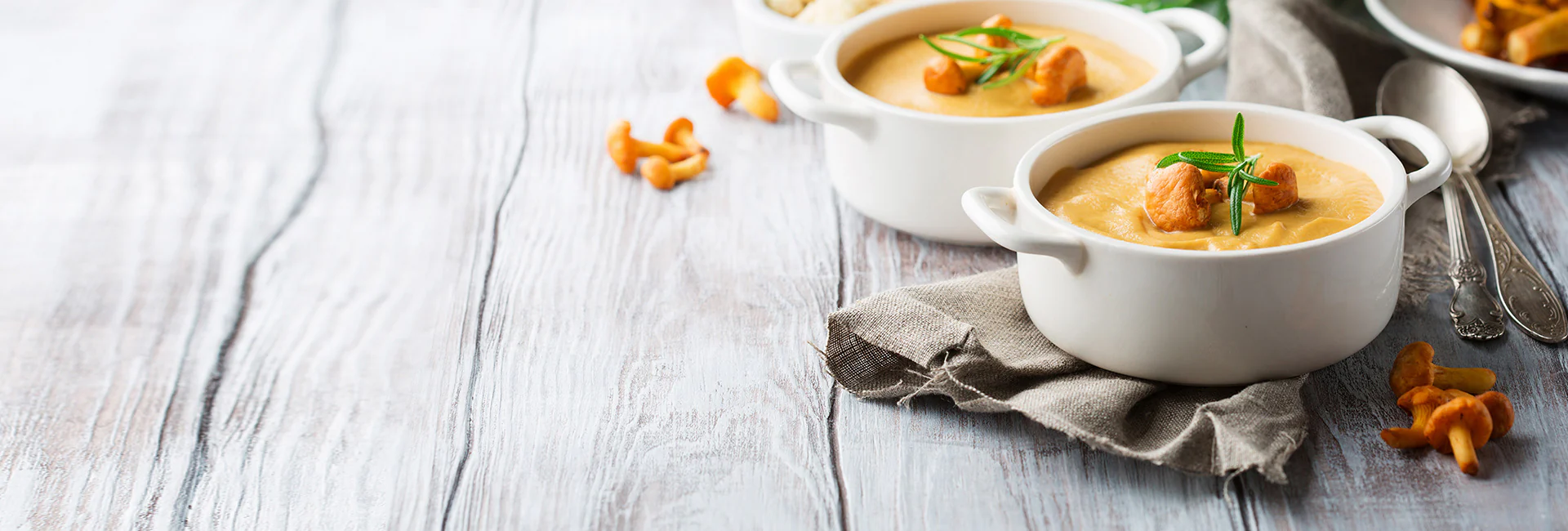Warm cream soup in white bowls